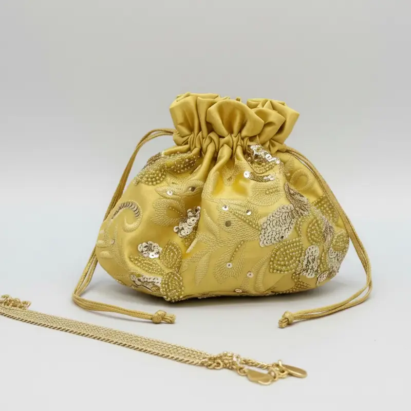 Bolso de fiesta tipo bombonera amarillo pastel con bordados y lentejuelas - mbyou