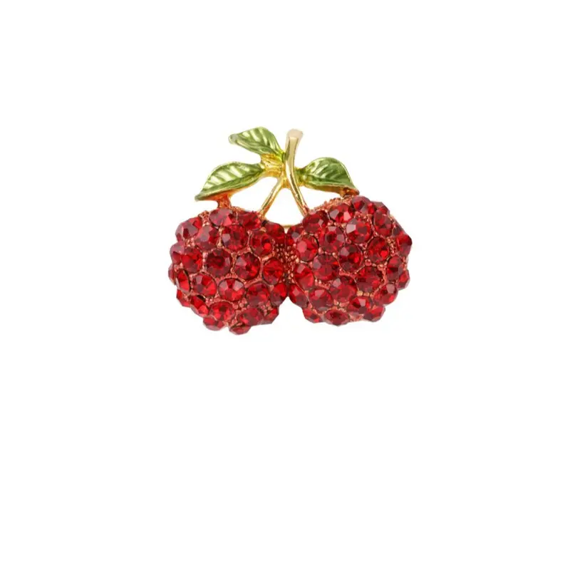 Broche de acero en forma de cerezas con circonitas y en acabado oro
