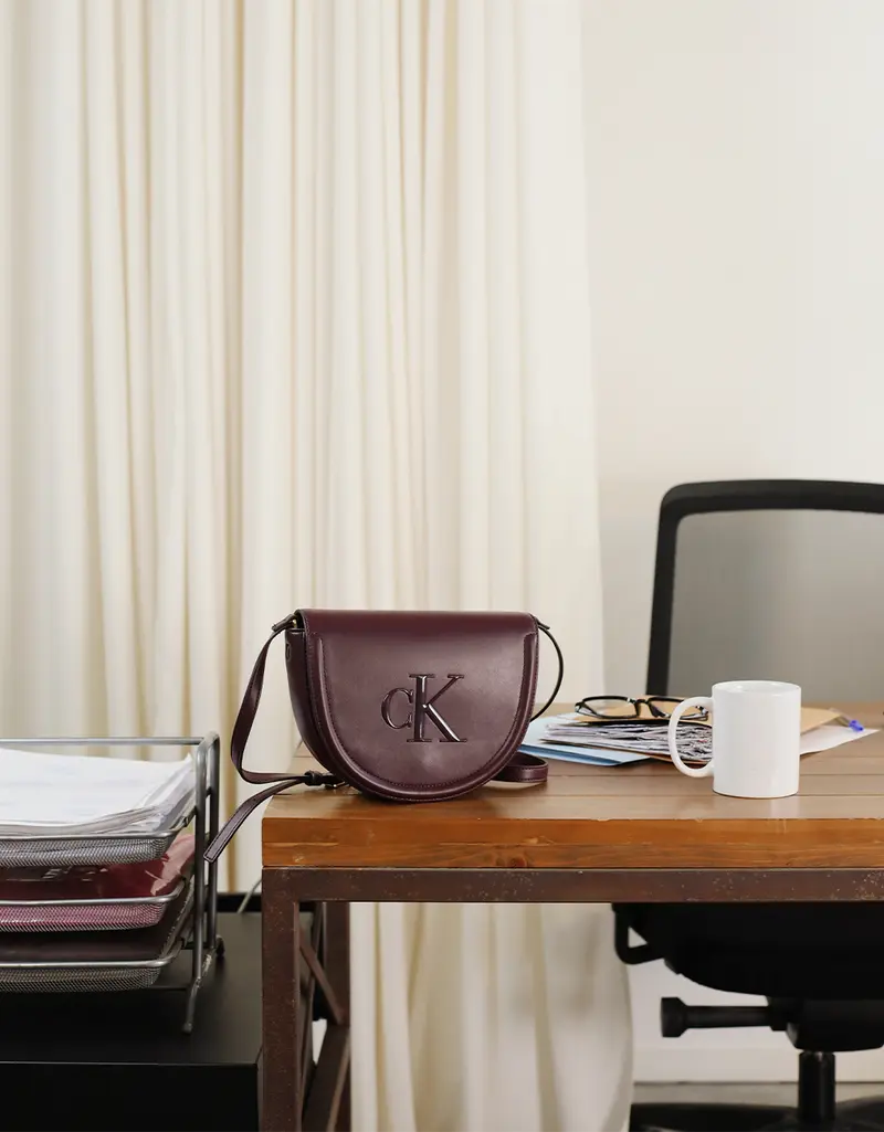 CALVIN KLEIN RAISED CK SADDLE CROSSBODY 88989