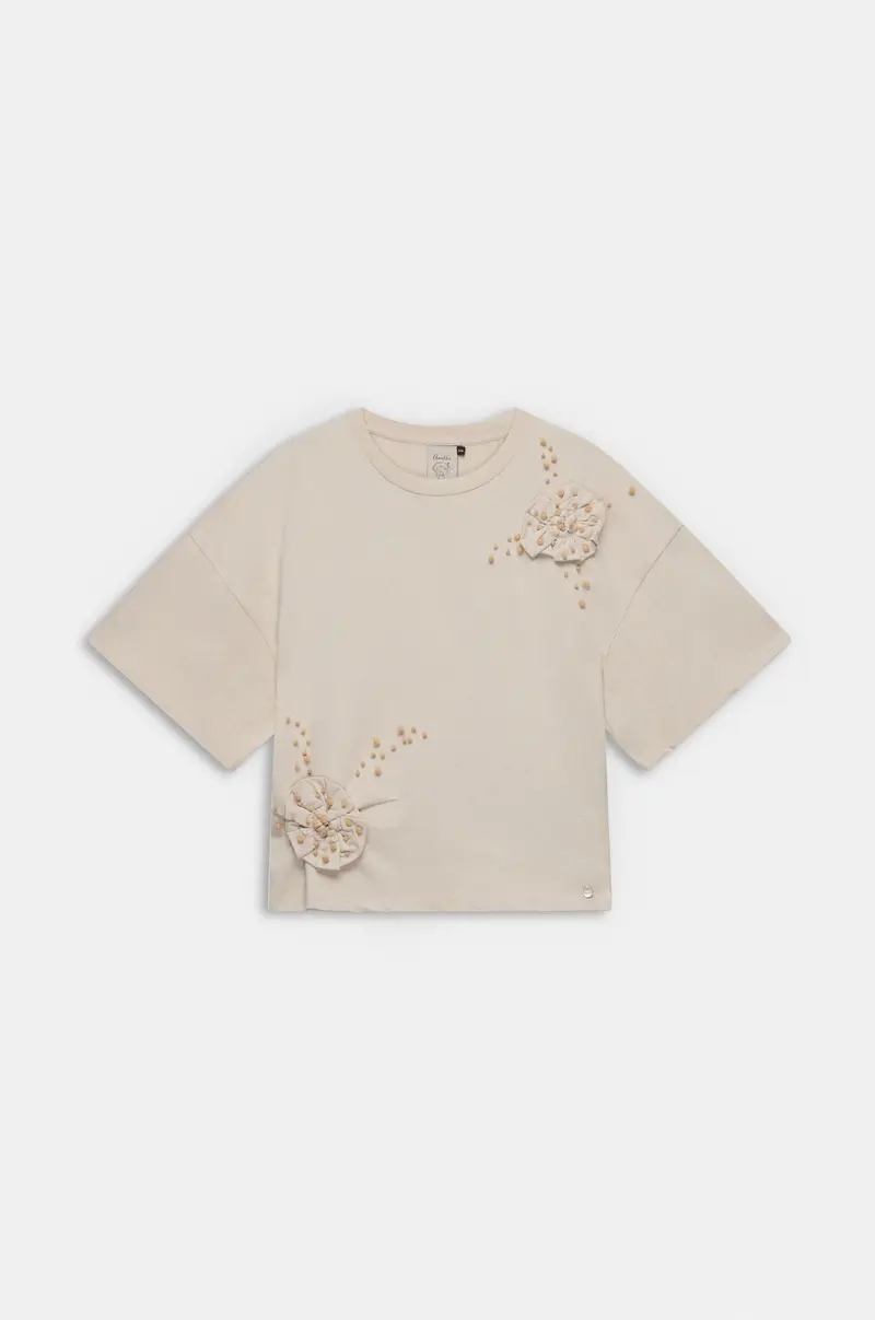 Camiseta beige con aplicación floral