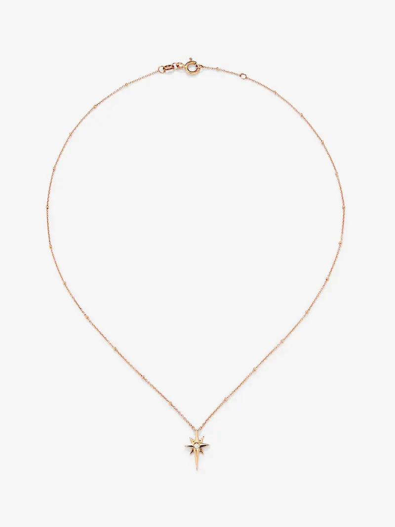 Colgante cadena con estrella de oro rosa de 18K con diamante