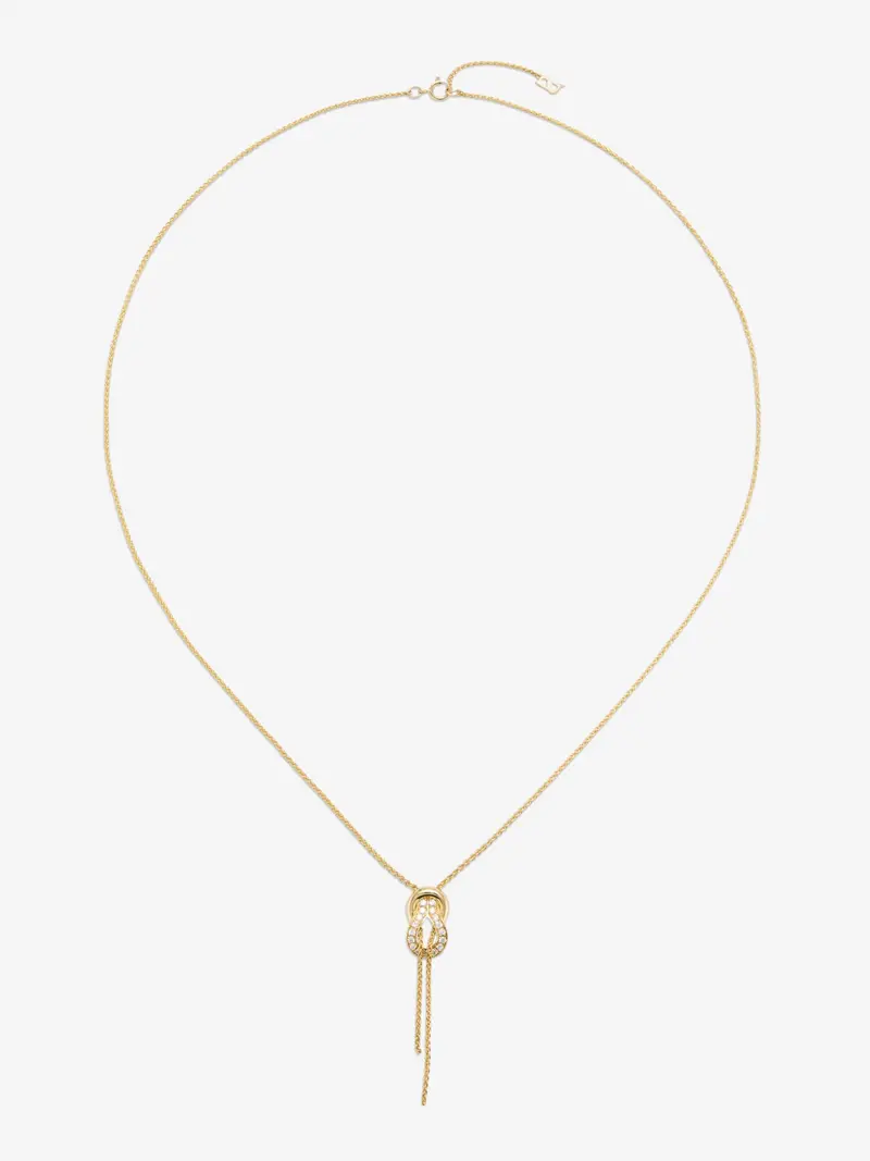 Colgante de oro amarillo de 18K con 26 diamantes en talla brillante con un total de 0,16 cts y forma de nudo