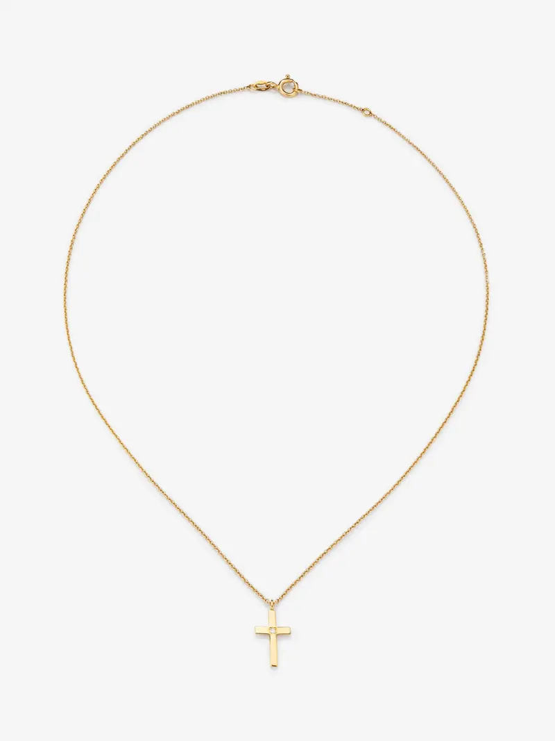 Colgante de oro amarillo de 18K con cruz mediana y diamante en talla brillante de 0,01 cts