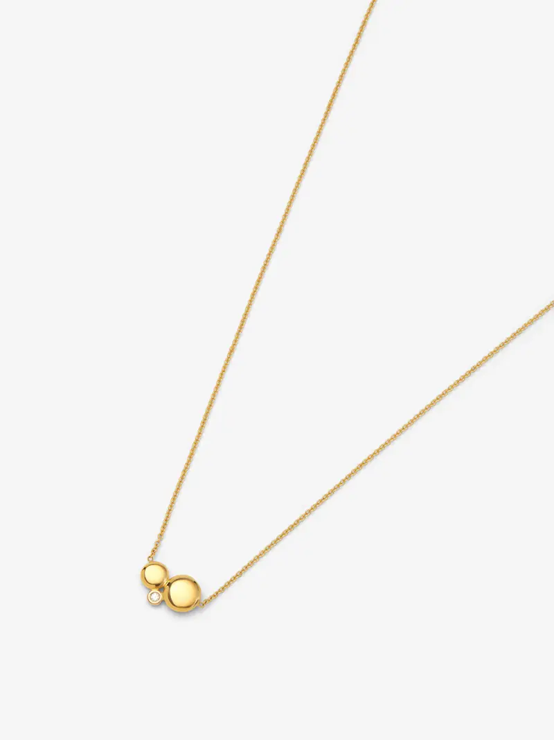 Colgante de oro amarillo de 18K con diamante de 0,03 cts y motivos de esferas