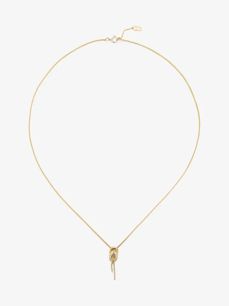 Colgante de oro amarillo de 18K con diamantes blancos en talla brillante de 0,05 cts y forma de nudo