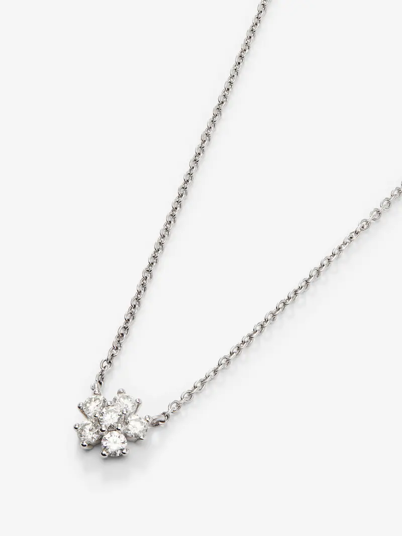 Colgante de oro blanco de 18K con 6 diamantes en talla brillante con un total de 0,31 cts y forma de flor