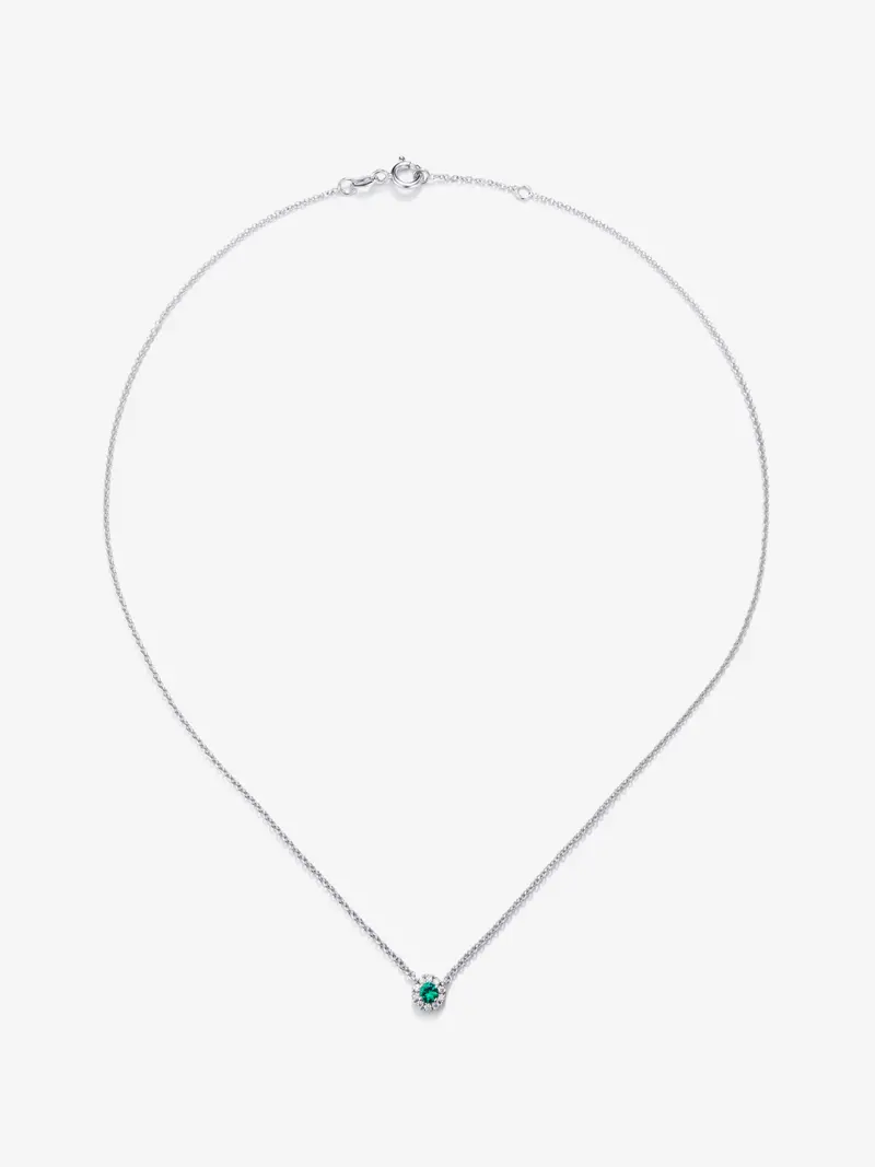Colgante de oro blanco de 18K con esmeralda en talla brillante de 0,255 cts y diamantes en talla brillante de 0,086 cts