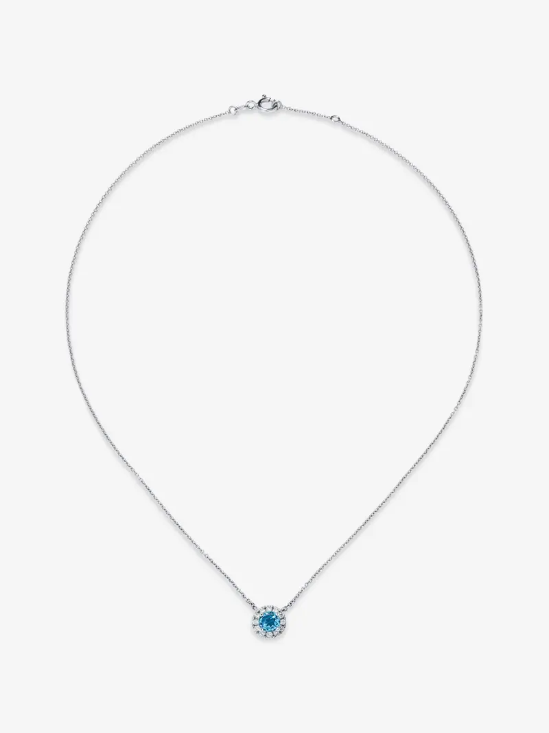 Colgante de oro blanco de 18K con topacio azul swiss 0,63 cts y diamantes 0,13 cts