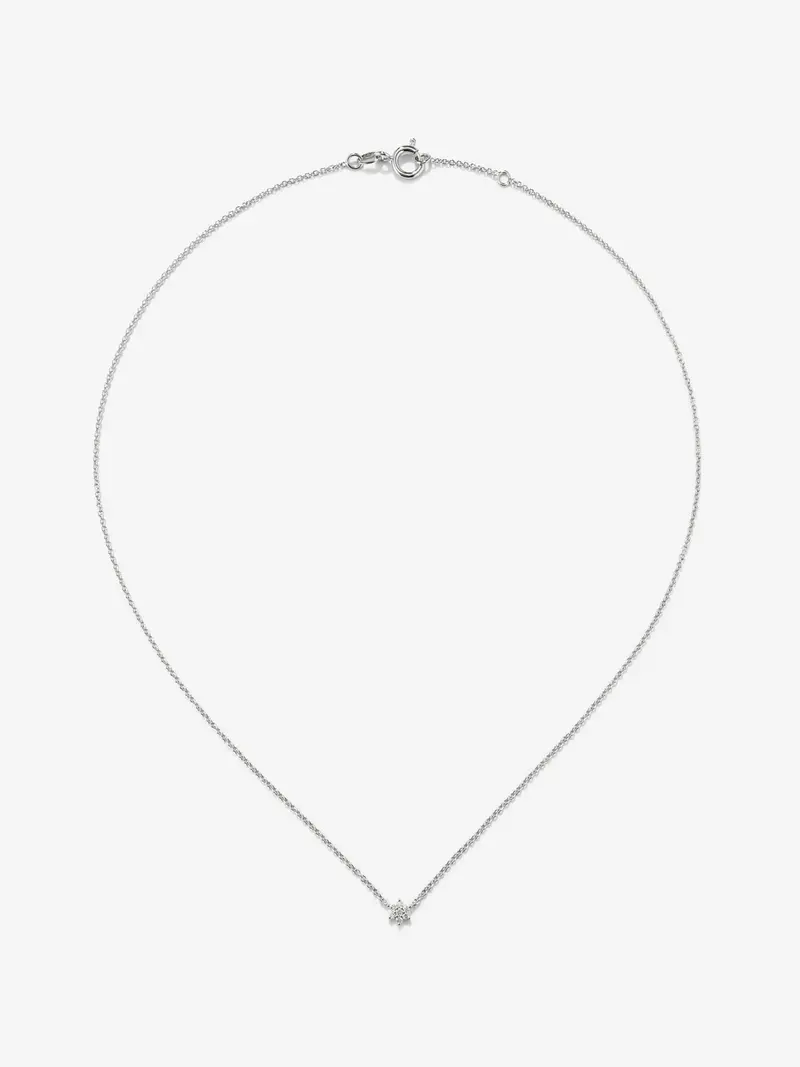 Colgante de oro blanco de 18K y diamantes en talla brillante de 0,08 cts y forma de estrella