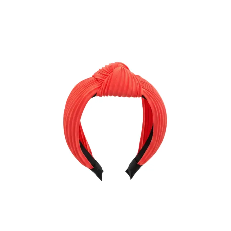 Diadema gruesa con nudo y diseño de dobleces en naranja neón