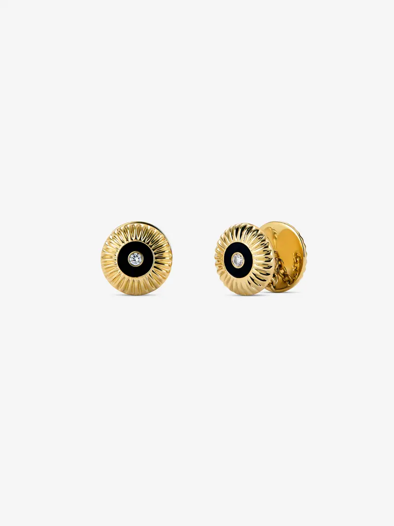 Gemelos de oro blanco de 18K con ónix negro en talla octogonal y diamantes en talla brillante con un total de 0,22 cts