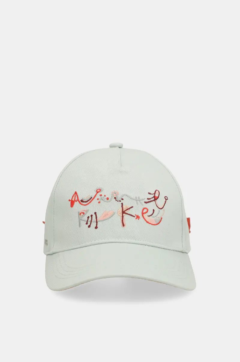 Gorra verde lazo rojo