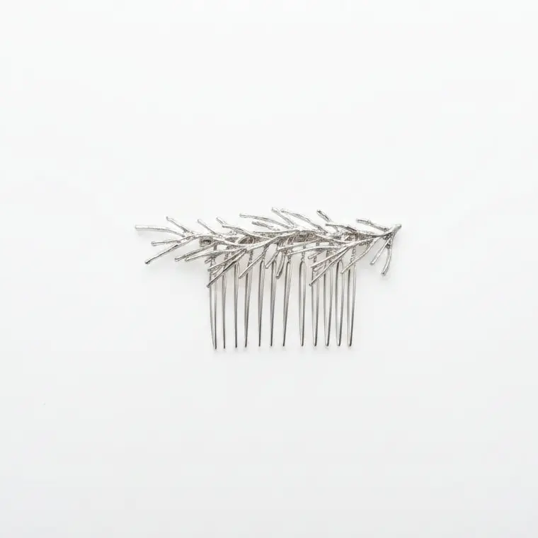 Peineta con diseño de rama con hojas en acabado plata