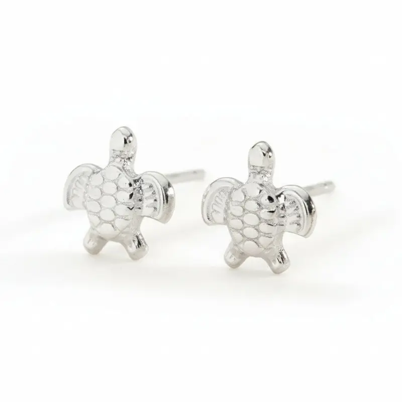 Pendientes cortos y pequeños de acero en forma de tortuga acabado plata