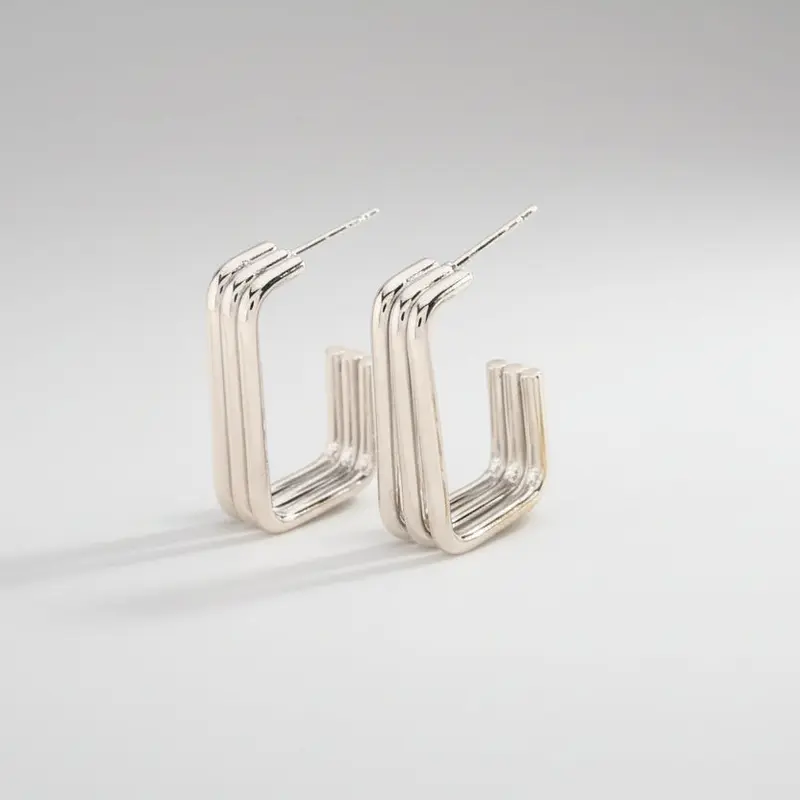 Pendientes de acero geométrico y de tres columnas acabado plata