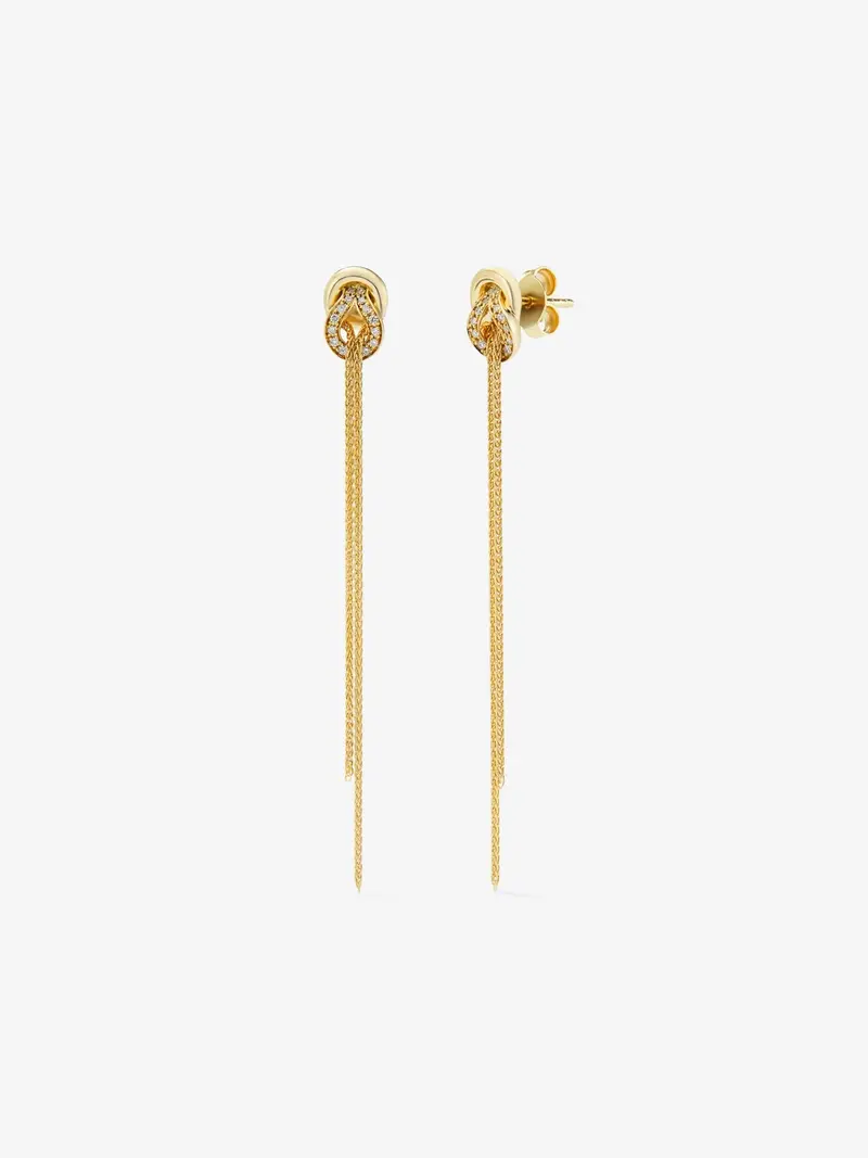 Pendientes largos de oro amarillo de 18K con diamantes blancos en talla brillante de 0,5 cts y forma de nudo