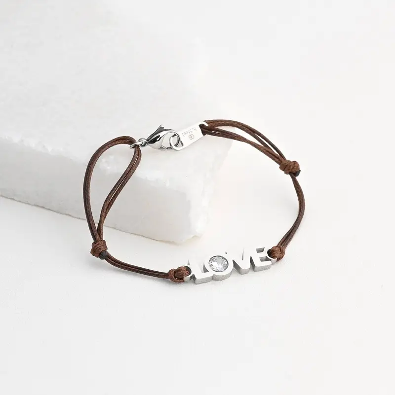 Pulsera de cuerda y acero con la palabra love y con brilli acabado plata