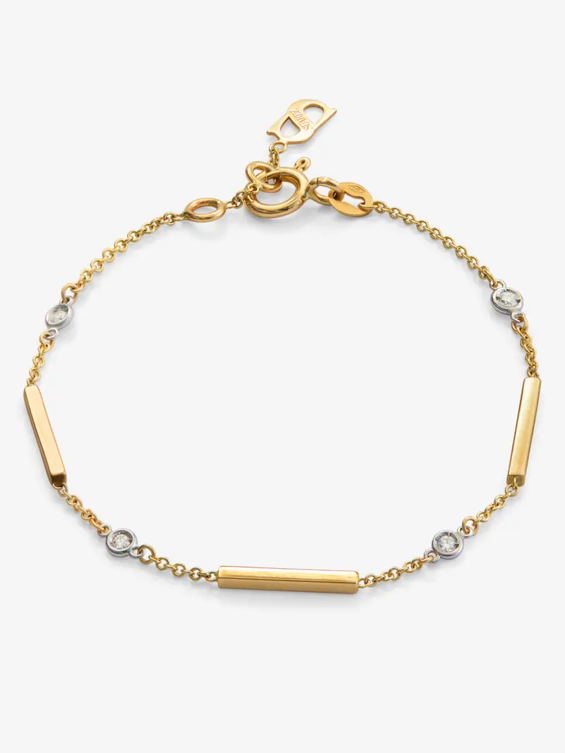 Pulsera de oro amarillo de 18K con 4 diamantes en talla brillante con un total de 0,1 cts