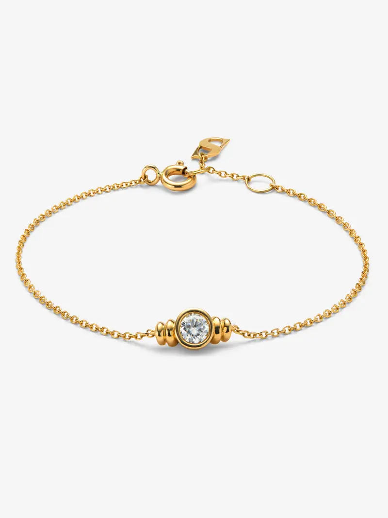 Pulsera de oro amarillo de 18K con diamante en talla brillante de 0,25 cts