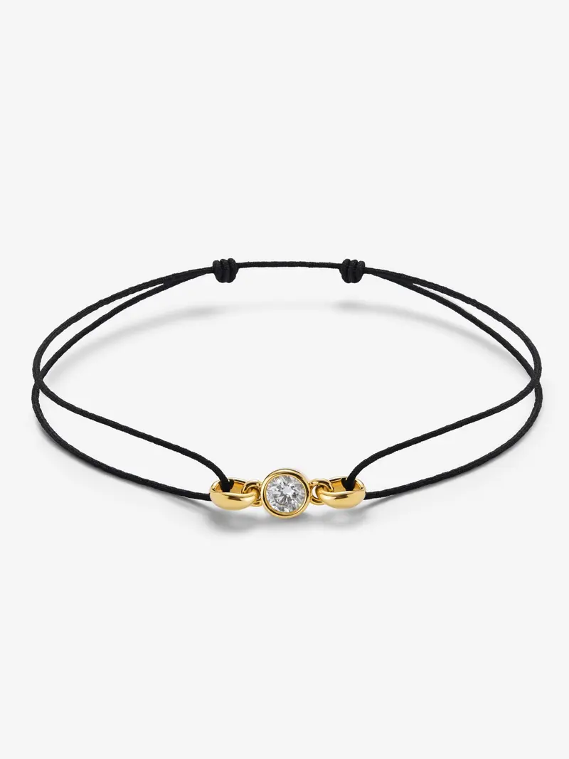 Pulsera de oro amarillo de 18K con diamante en talla brillante de 0,4 cts