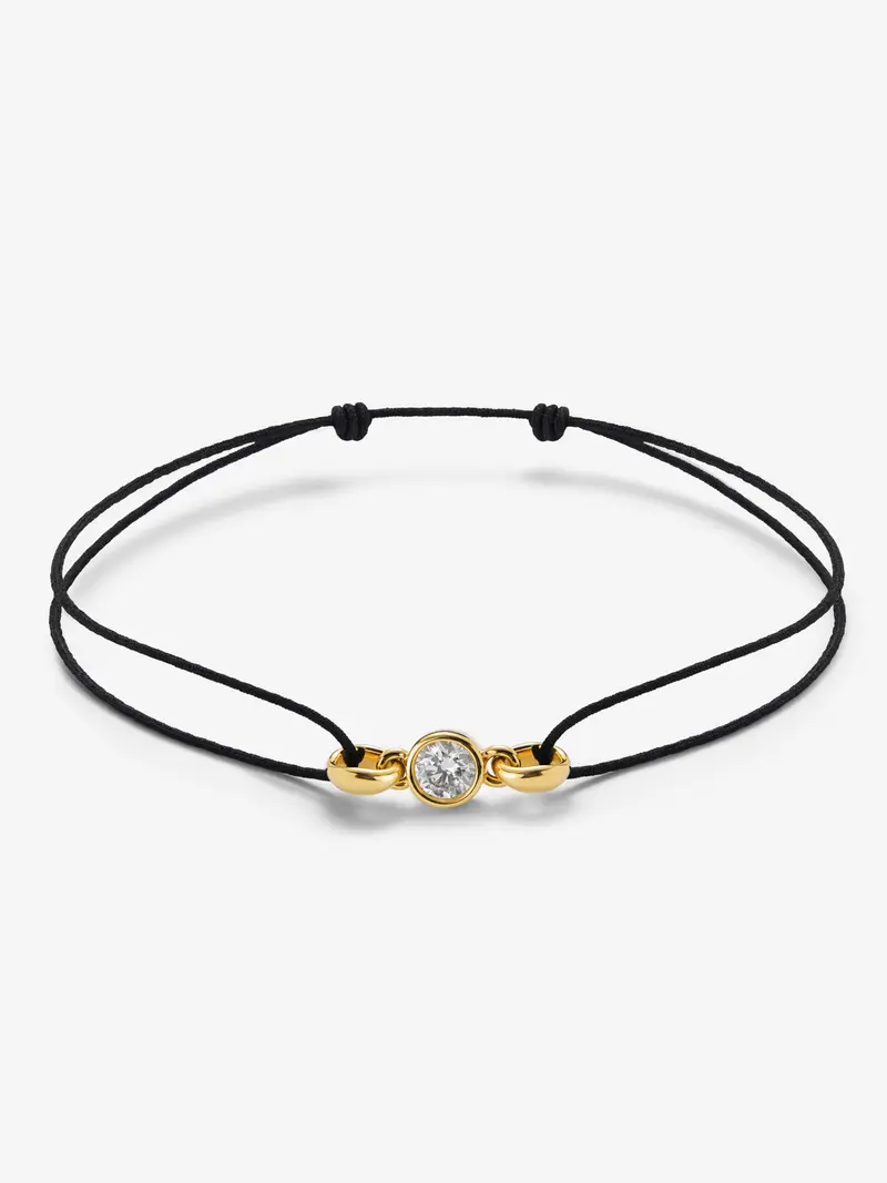 Pulsera de oro amarillo de 18K con diamante en talla brillante de 0,4 cts