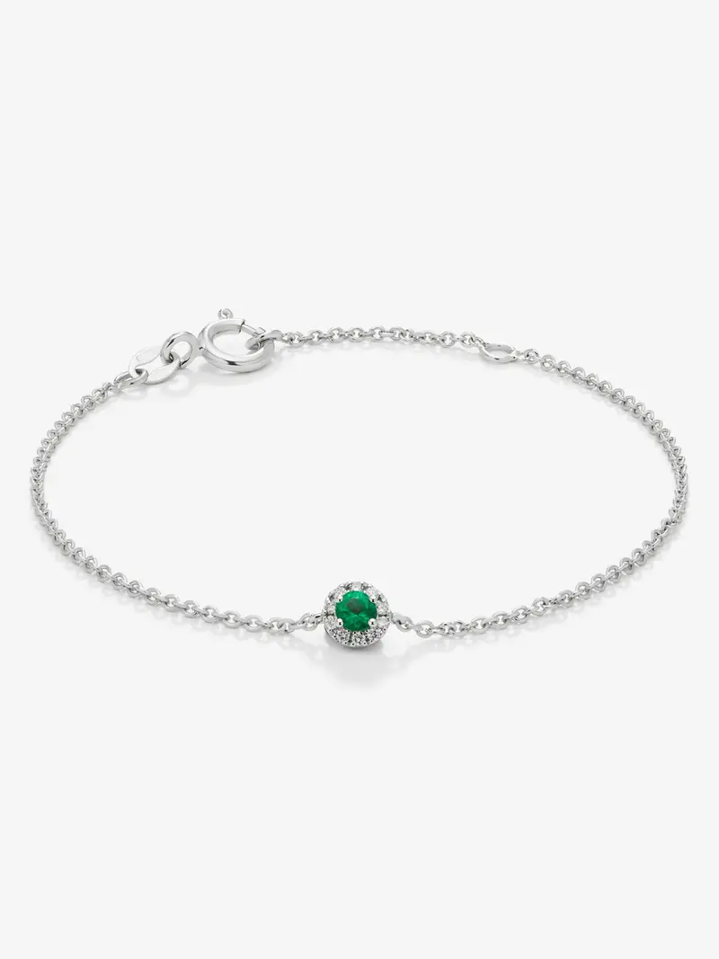 Pulsera de oro blanco de 18K con esmeralda en talla brillante de 0,1 cts y diamantes en talla brillante de 0,05 cts
