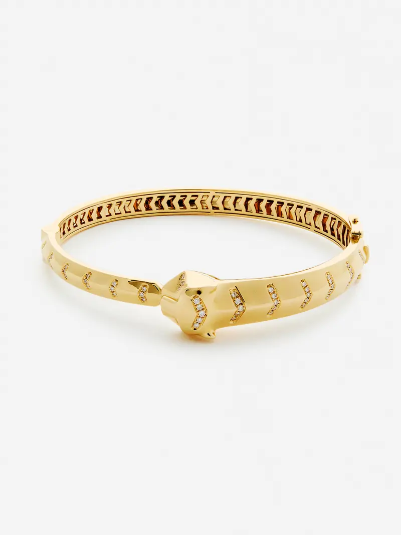Pulsera rígida de oro amarillo de 18K con 61 diamantes en talla brillante con un total de 0,23 cts y forma de tigre