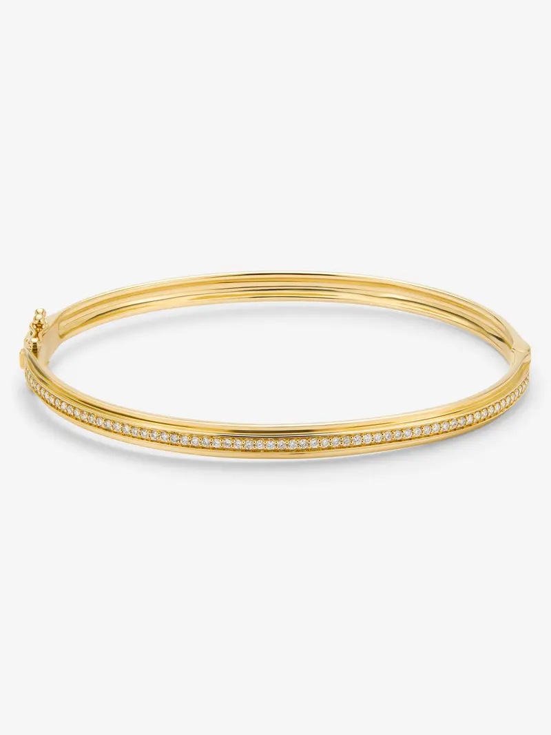 Pulsera rígida de oro amarillo de 18K con 64 diamantes en talla brillante con un total de 0,38 cts