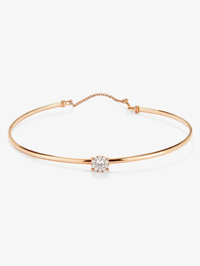 Pulsera rígida de oro rosa de 18K con 11 diamantes en talla brillante con un total de 0,21 cts