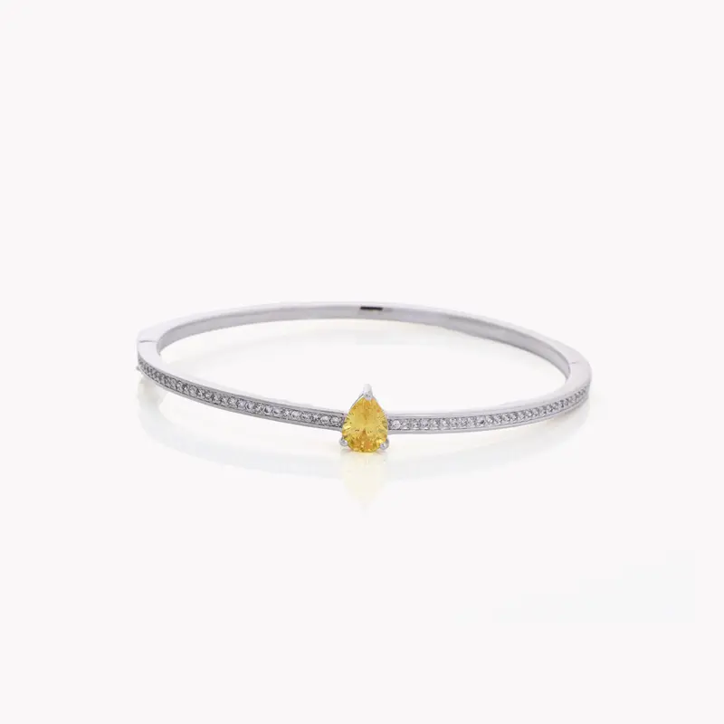 Pulsera rígida semijoya con circonitas y piedra oval amarilla