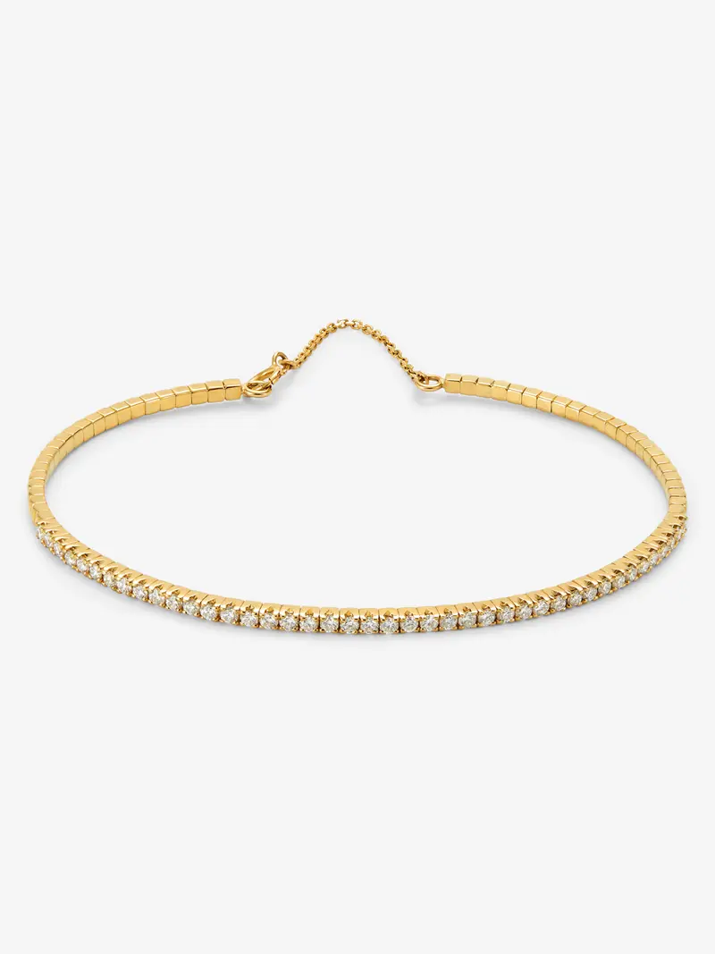 Pulsera rivière de oro amarillo de 18K con diamantes en talla brillante con un total de 0,68 cts